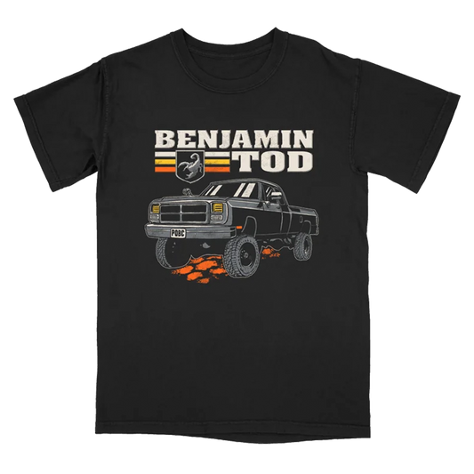 Truck graphic with Benjamin Tod text on the front of a black tee