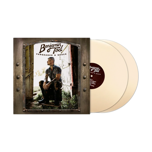 A vinyl record package, album cover with a printed photo of a man sitting in a doorway, next to two translucent cream-colored records. The cover text reads 'Benjamin Todd' and 'Vengeance & Grace'.
