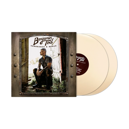 A vinyl record package, album cover with a printed photo of a man sitting in a doorway, next to two translucent cream-colored records. The cover text reads 'Benjamin Todd' and 'Vengeance & Grace'.