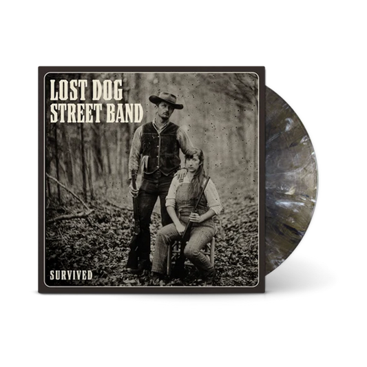 Lost Dog Street Band 'Survived' vinyl record album with a sepia-toned cover photo of two people outdoors and a translucent marbled black-and-white record partially visible behind the sleeve.
