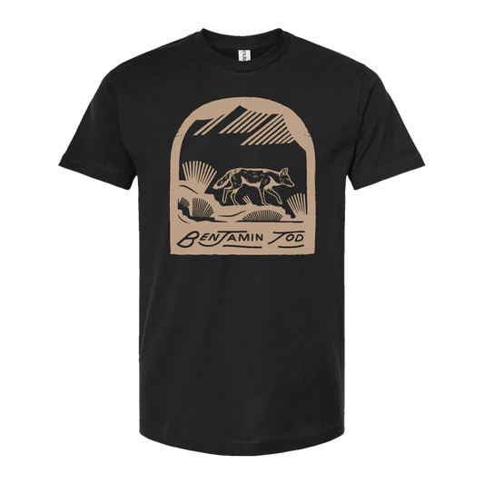 Coyote graphic printed in tan on the front of a black tee with Benjamin Tod text