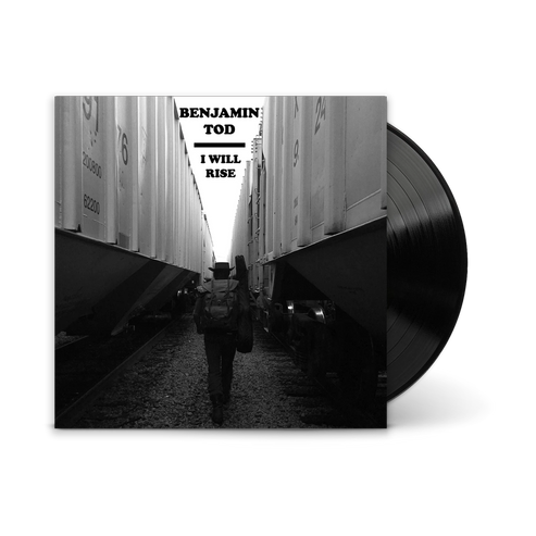 Vinyl record album cover for 'I Will Rise' by Benjamin Todd, featuring a black and white photo of him walking between train cars, with the black record partially visible on the right